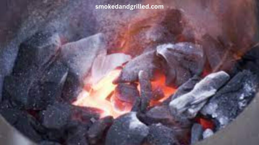 How many charcoal briquettes should I use for grilling burgers on a small charcoal grill?